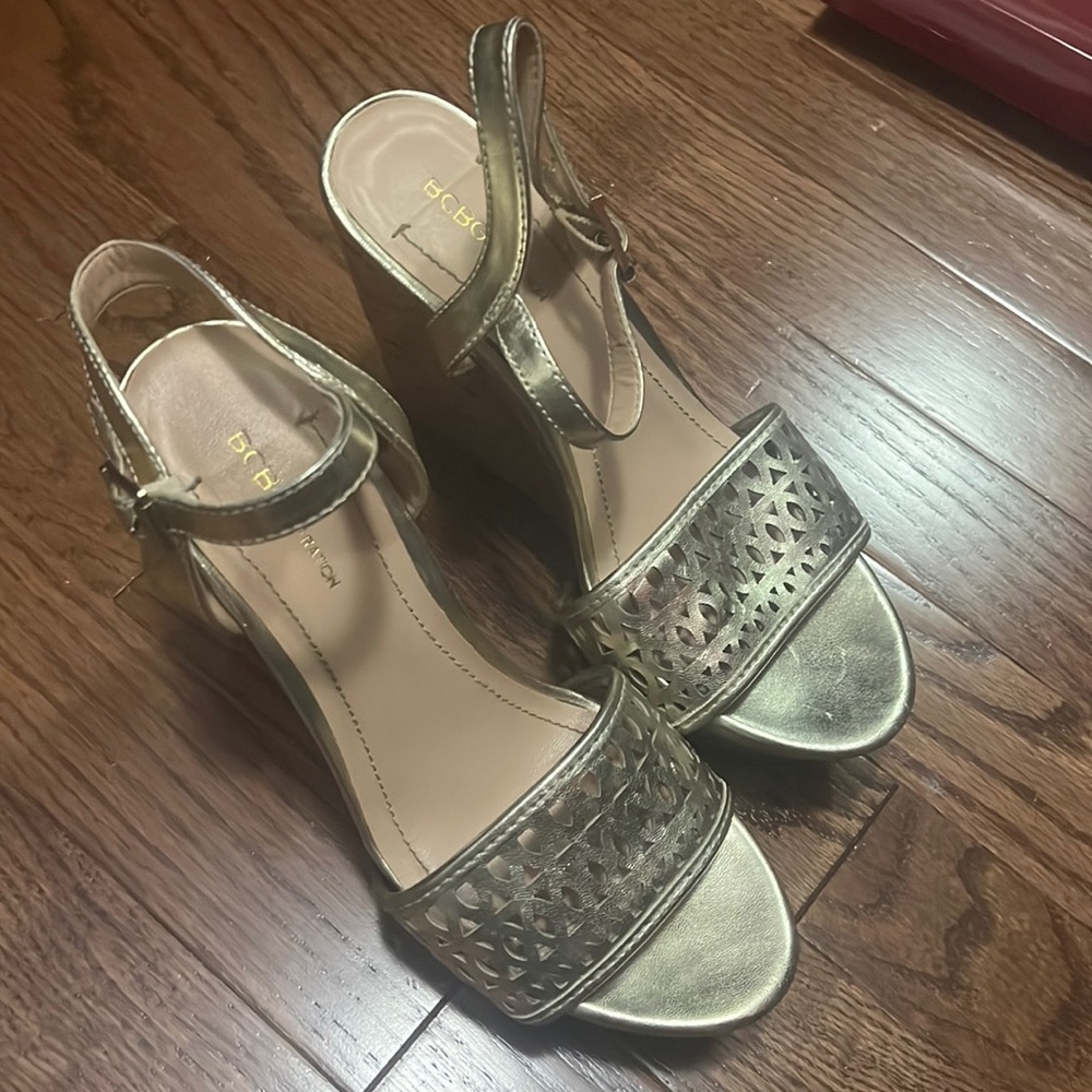 Gold cutout front platform high wedge sandals . Open toe. Size 6. Gently used.